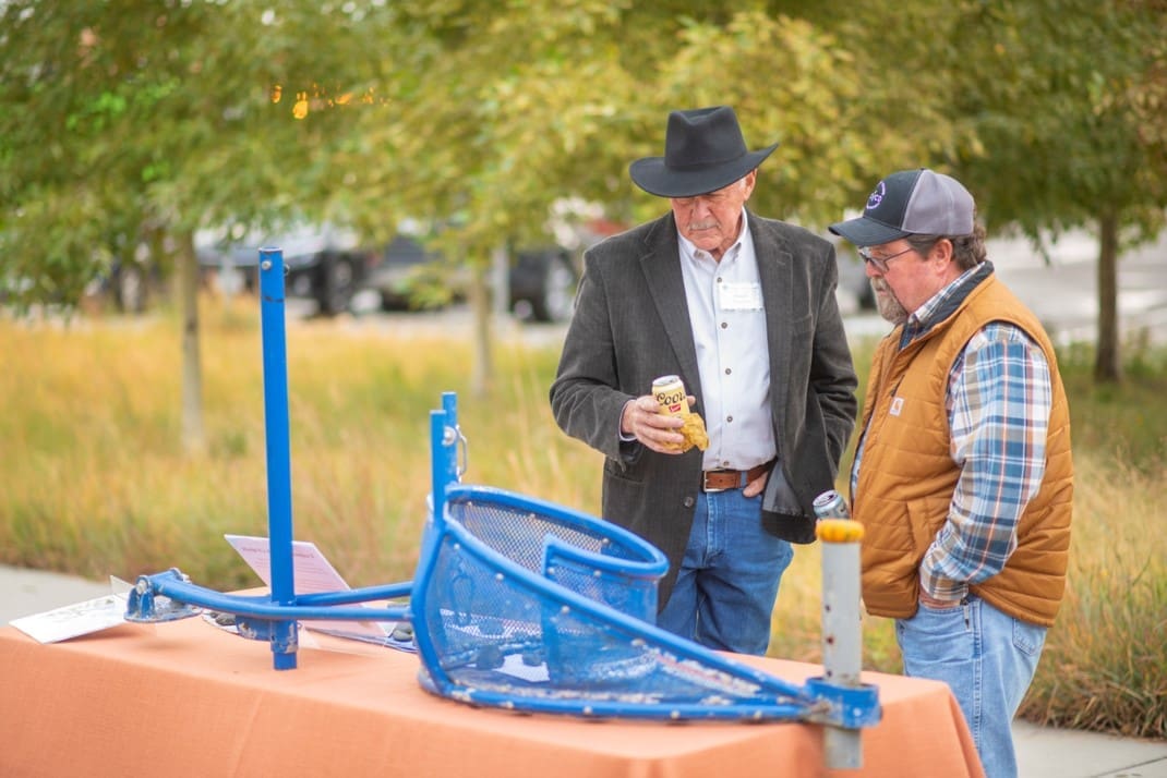 Reception on the River guest look at the prototype for the Nautilus trash removal system pioneered by The Greenway Foundation.